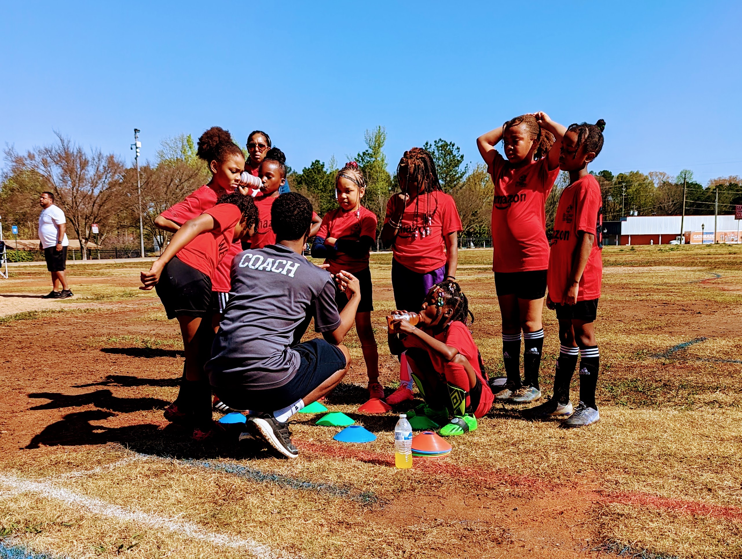 Coach giving his team a pep-talk!! Soccer in the Streets West End Girls